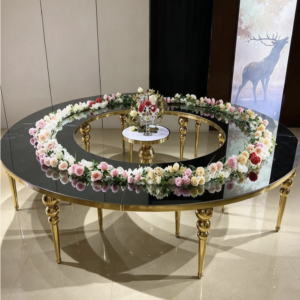 Black round center hole table with gold legs and acrylic chairs