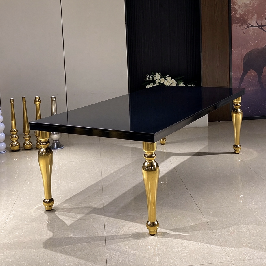 Black top wedding banquet table with polished gold carved legs