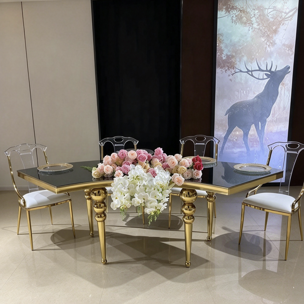 Black round center hole table with gold legs and acrylic chairs