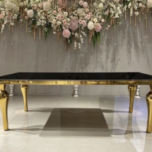 Black top gold leg console table with luxury floral wedding backdrop