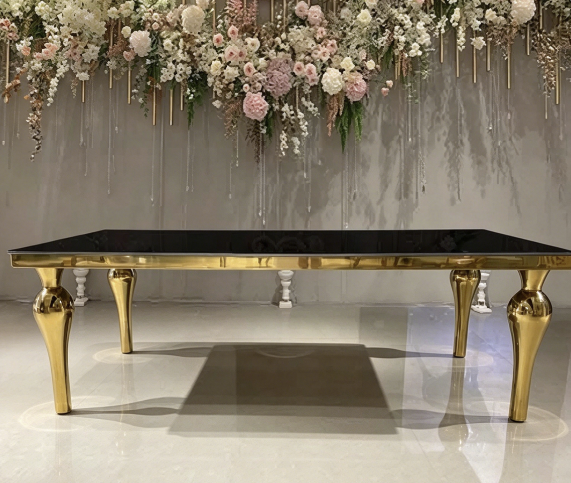 Black top gold leg console table with luxury floral wedding backdrop