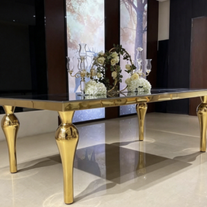 659e0cd5-3a8d-45ac-8dc4-f7d76923a055 Black top gold leg console table with luxury floral wedding backdrop
