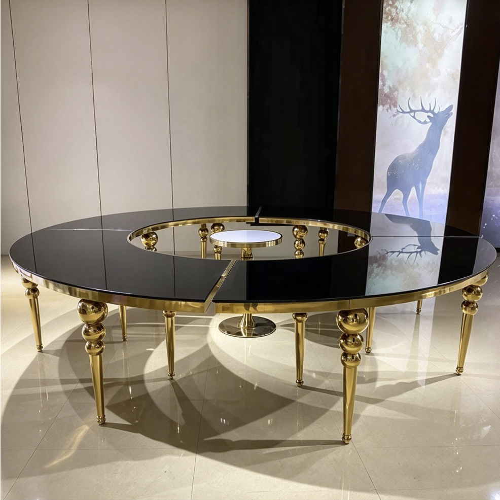 Black round center hole table with gold legs and acrylic chairs