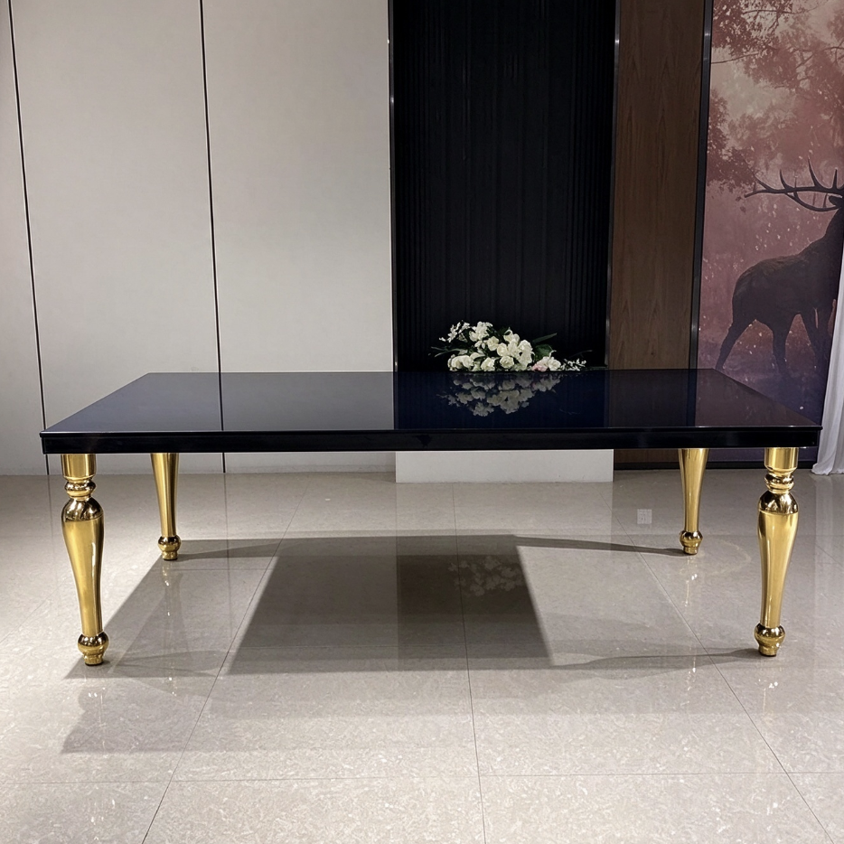 Black top wedding banquet table with polished gold carved legs