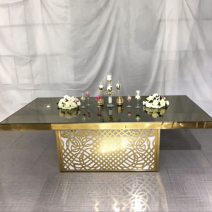 Mirror top wedding banquet table with ornate gold lattice base from Xingchen Furniture