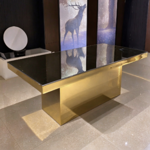 Black mirror top wedding banquet table with ornate gold carved base from Xingchen Furniture