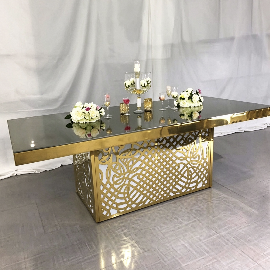 Mirror top wedding banquet table with ornate gold lattice base from Xingchen Furniture