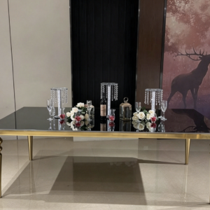 Black glass dining table with polished gold turned legs for wedding decor | Xingchen Furniture