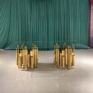 Glass top wedding banquet table with gold column base manufactured by Xingchen Furniture