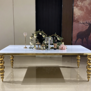 White top gold spindle leg dining table with floral centerpiece for wedding decor