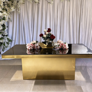 Black mirror top wedding banquet table with ornate gold carved base from Xingchen Furniture