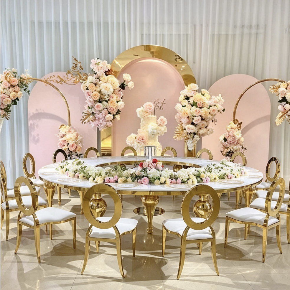 White round center hole table with gold legs and pink arch decor