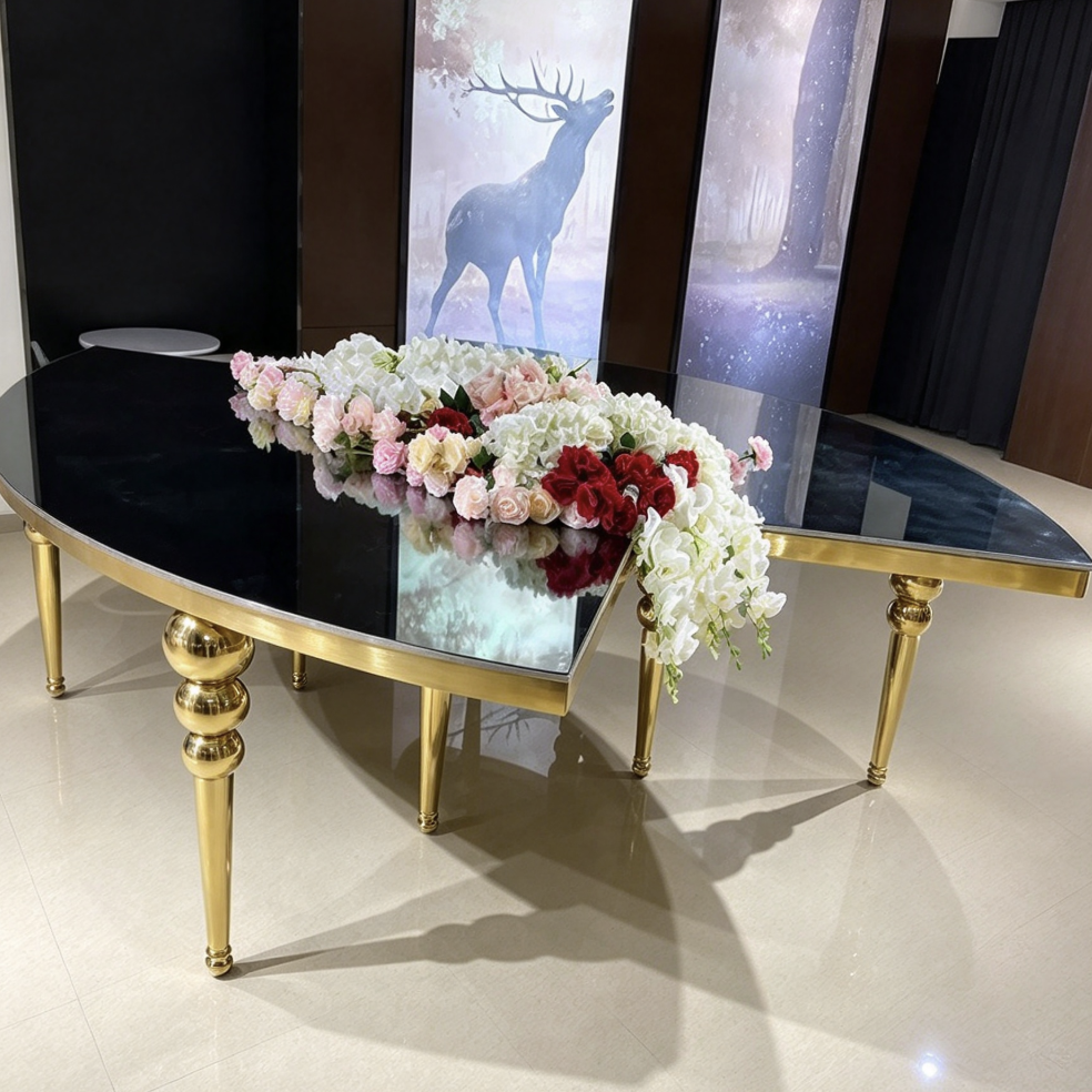 Black round center hole table with gold legs and acrylic chairs