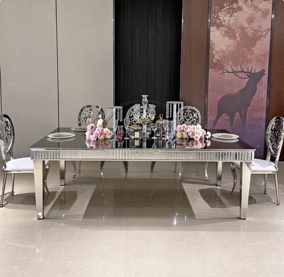 Black mirror top silver leg wedding banquet table with ghost chairs from Xingchen Furniture
